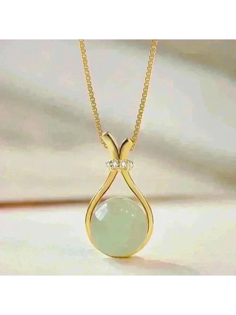 Jade Stone Encased In A Sleek Gold Necklace, Accented With A Sparkling C